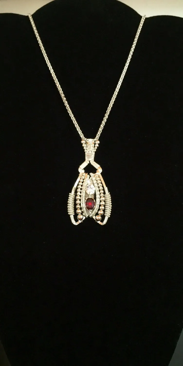 Garnet and Topaz Coiled Amulet
