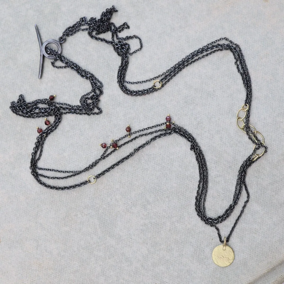 Parchment Disk Triple Chain Necklace with Garnets