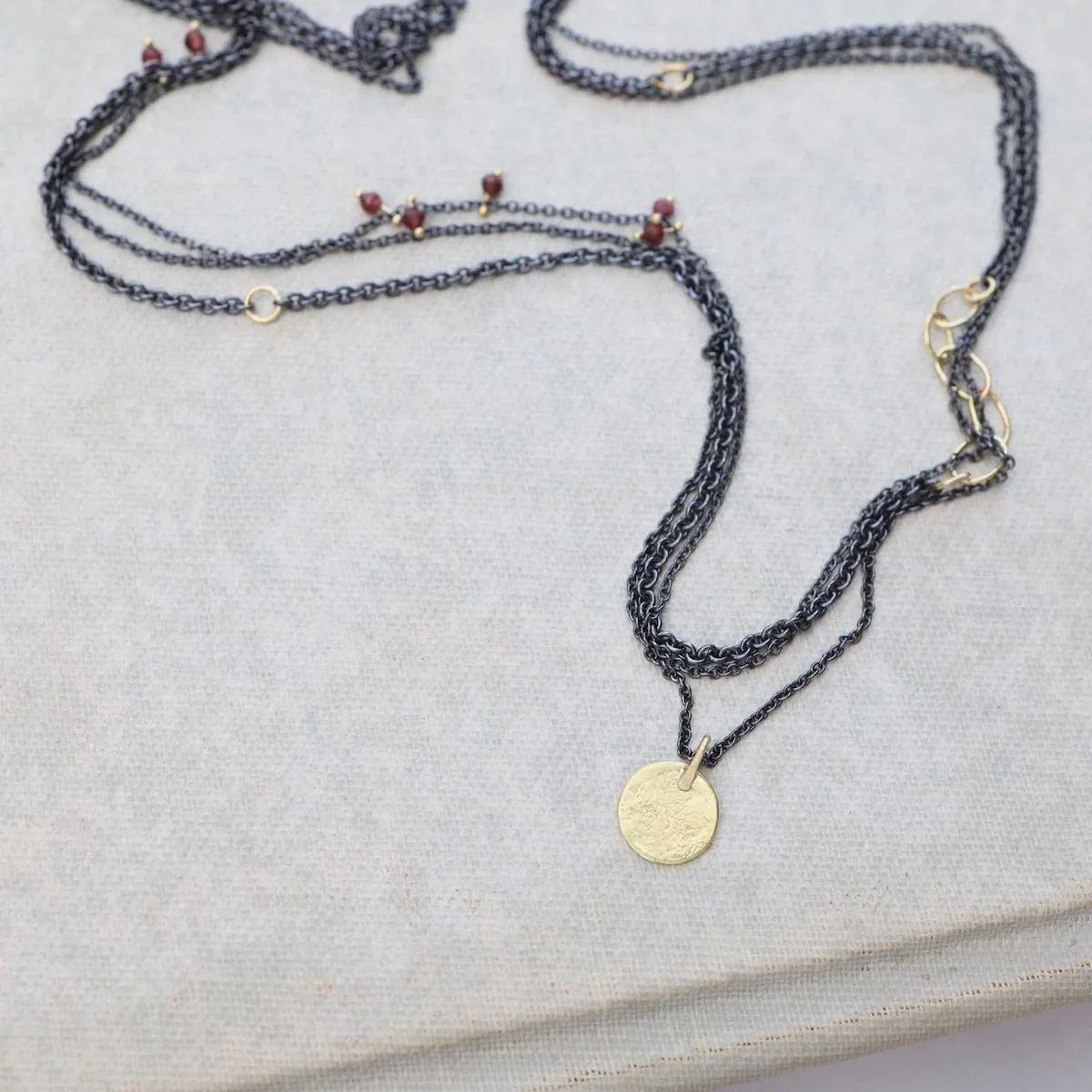 Parchment Disk Triple Chain Necklace with Garnets